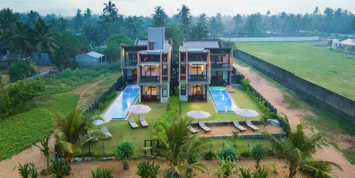 nidi Leisure two beach villas in Wadduwa, Sri Lanka with coconut trees and two pools.