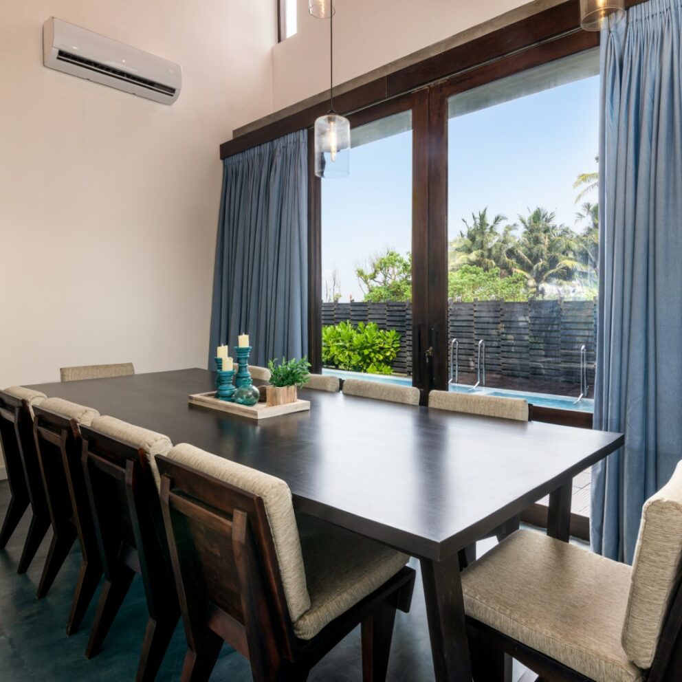 Dining table with view of the pool of the villa