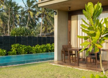 Tables arranged in the seating areas of the villas.