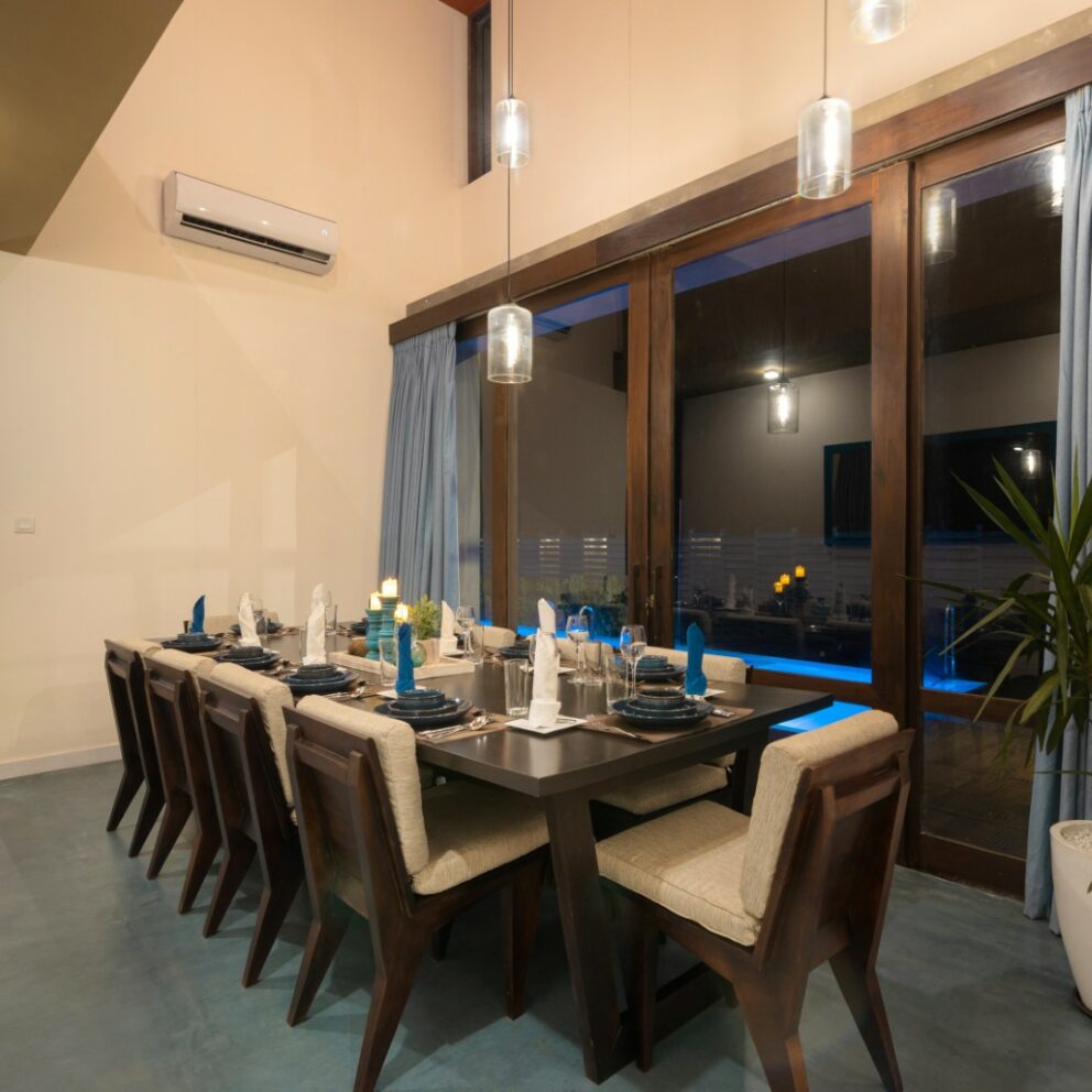 Dining table with view of the pool of the villa