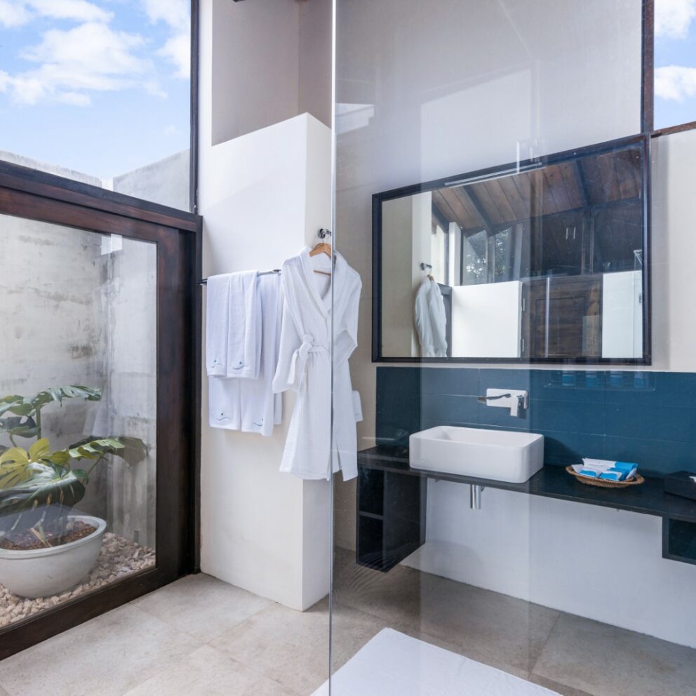 Bathroom arranged with Bathrobes Bath towels and other amenities