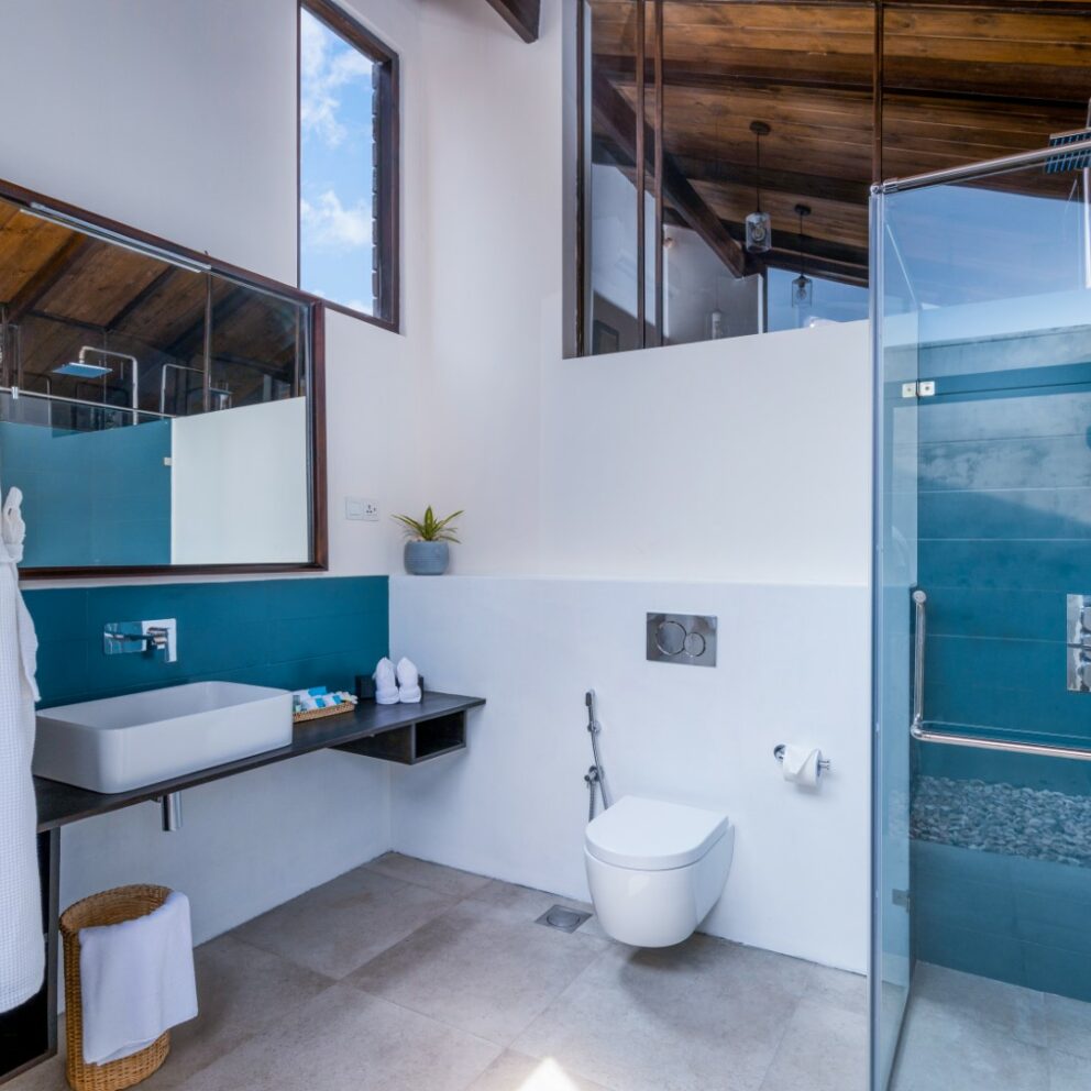 Bathroom arranged with Bathrobes Bath towels and other amenities