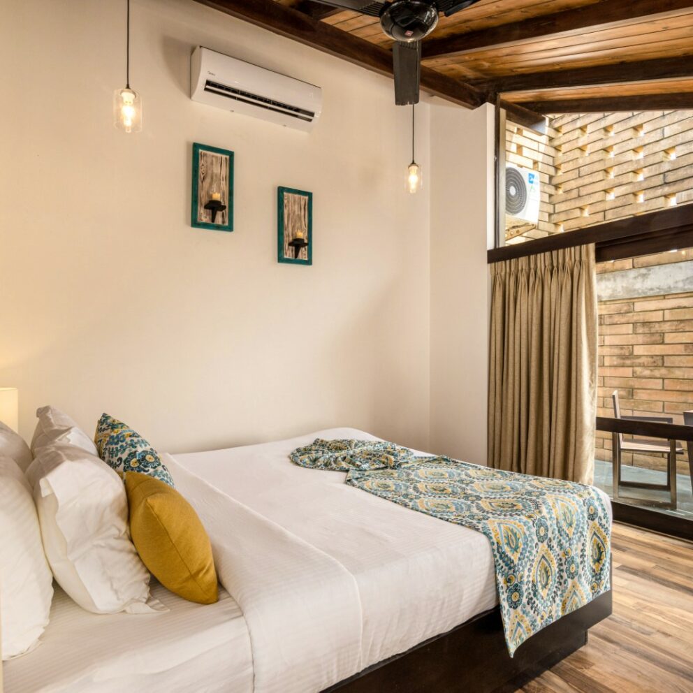 Arranged bed room in the villa with tables in the terrace area