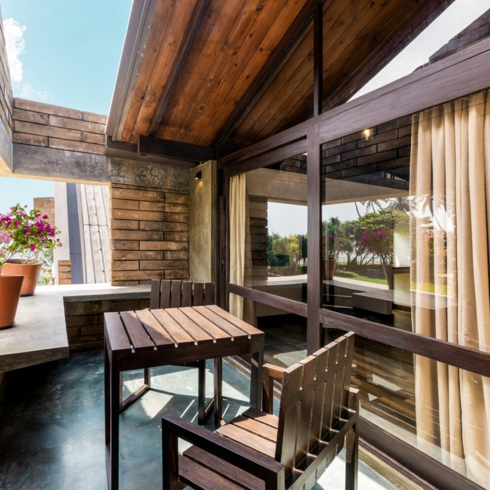 Tables arranged in the seating areas of the villas