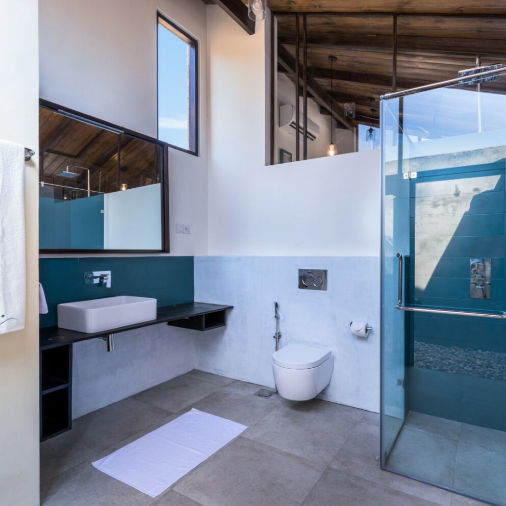 Bathroom arranged with Bathrobes Bath towels and other amenities